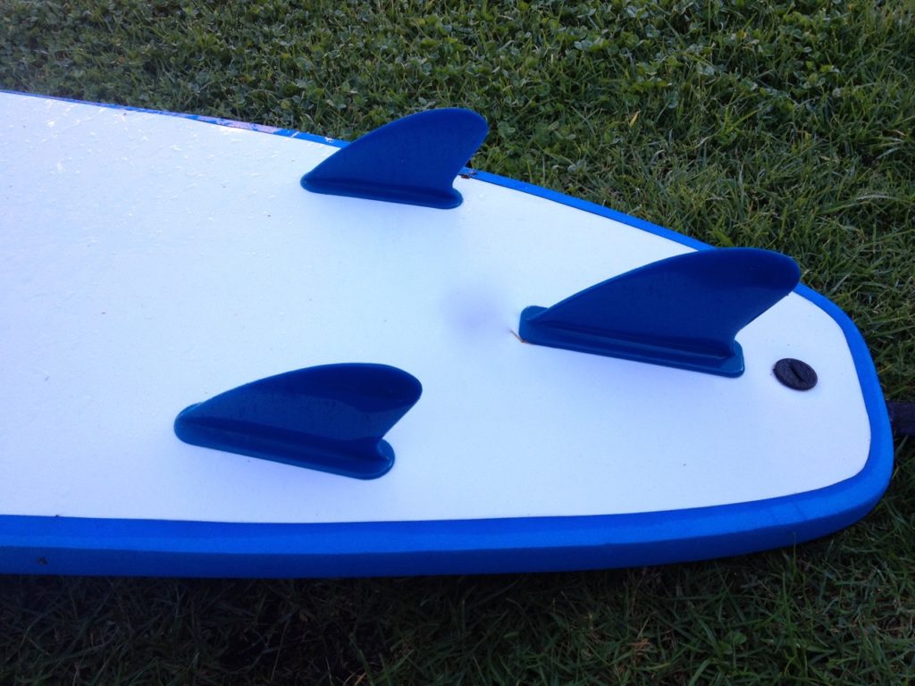 Surfboard hire blue coloured surfboard fins