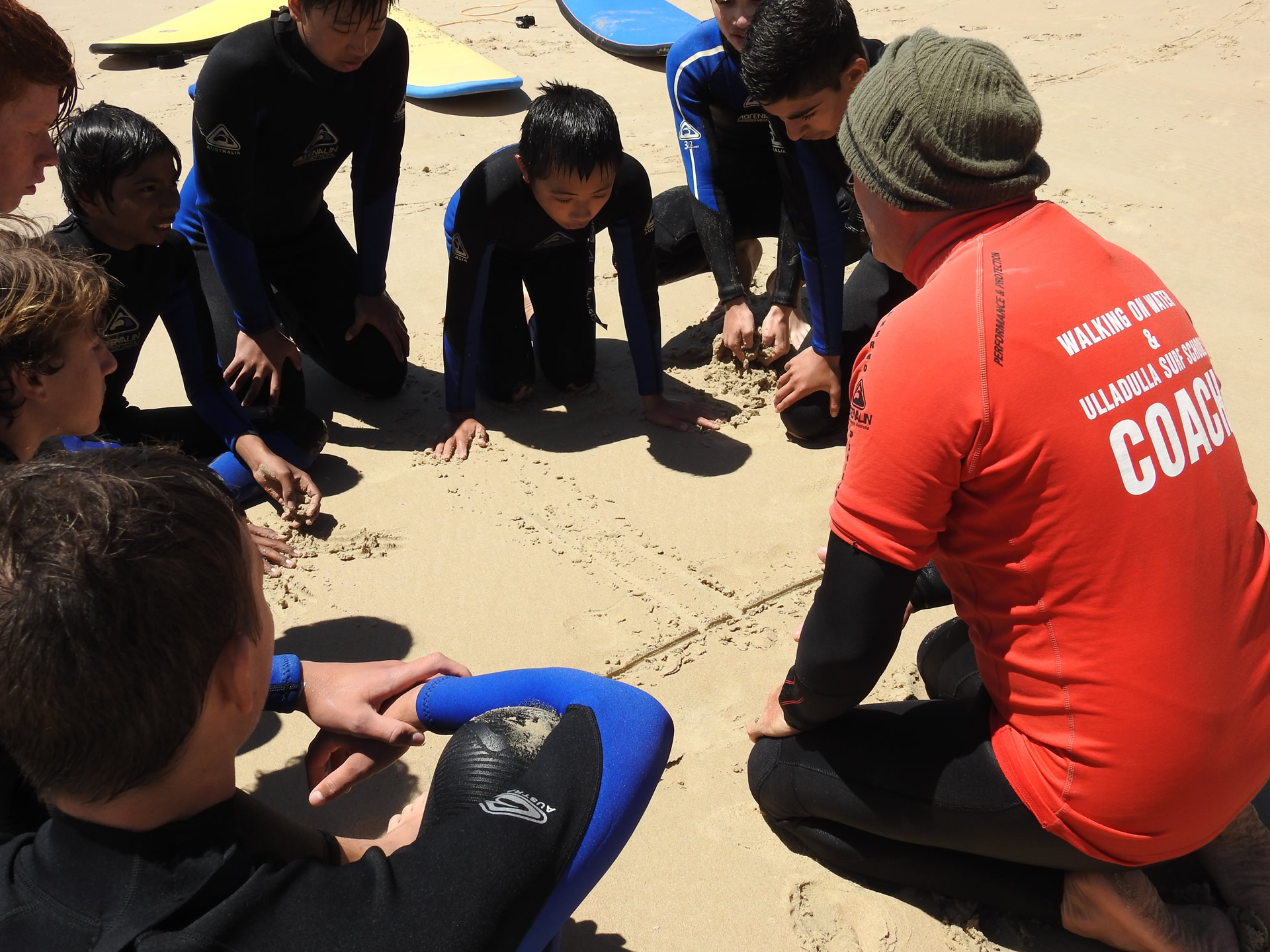 Surf awareness course participants learning ocean safety skills with WOW Watersports Shoalhaven
