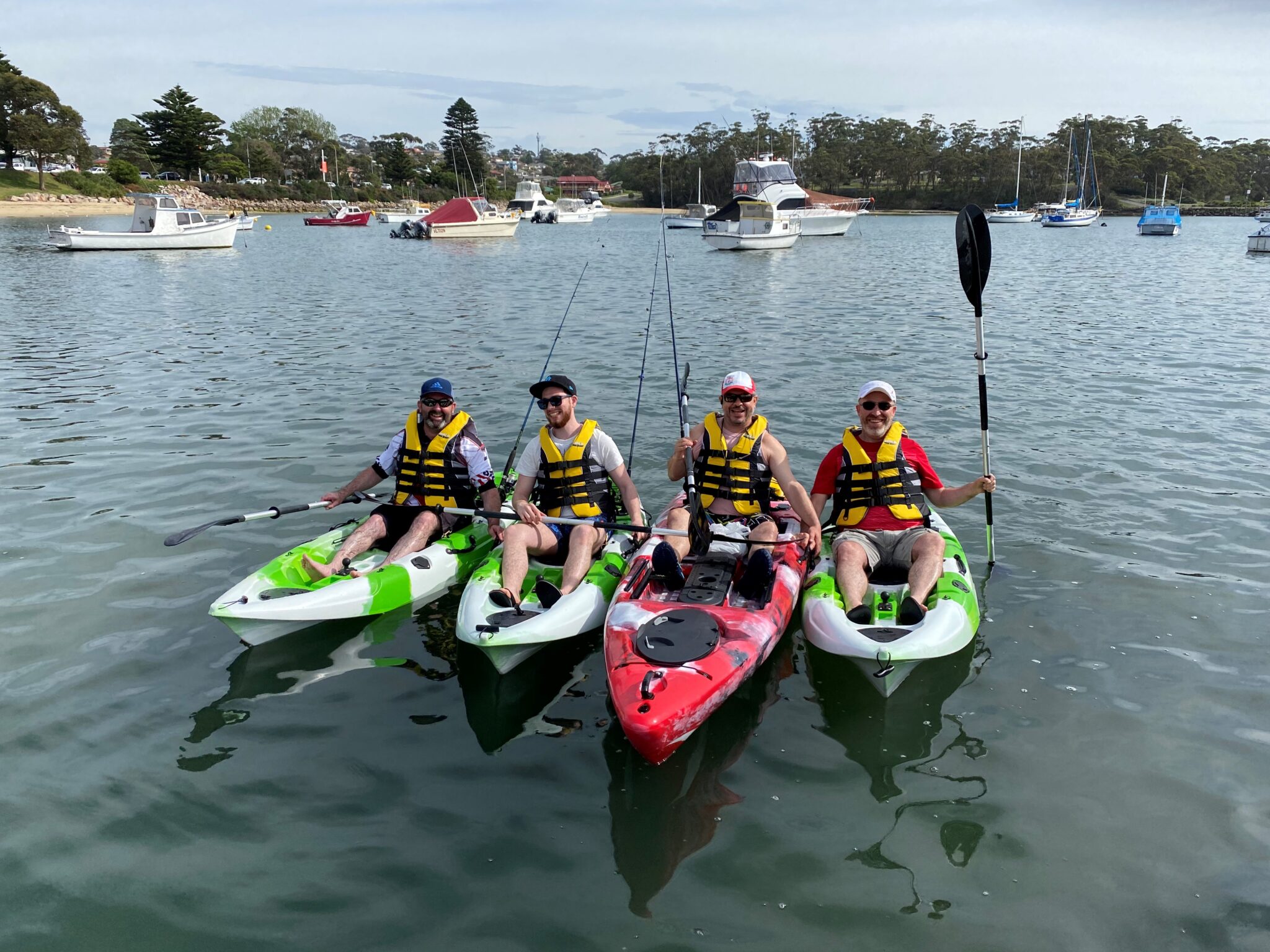 Kayakers exploring beautiful Shoalhaven waterways with scenic views and peaceful nature
