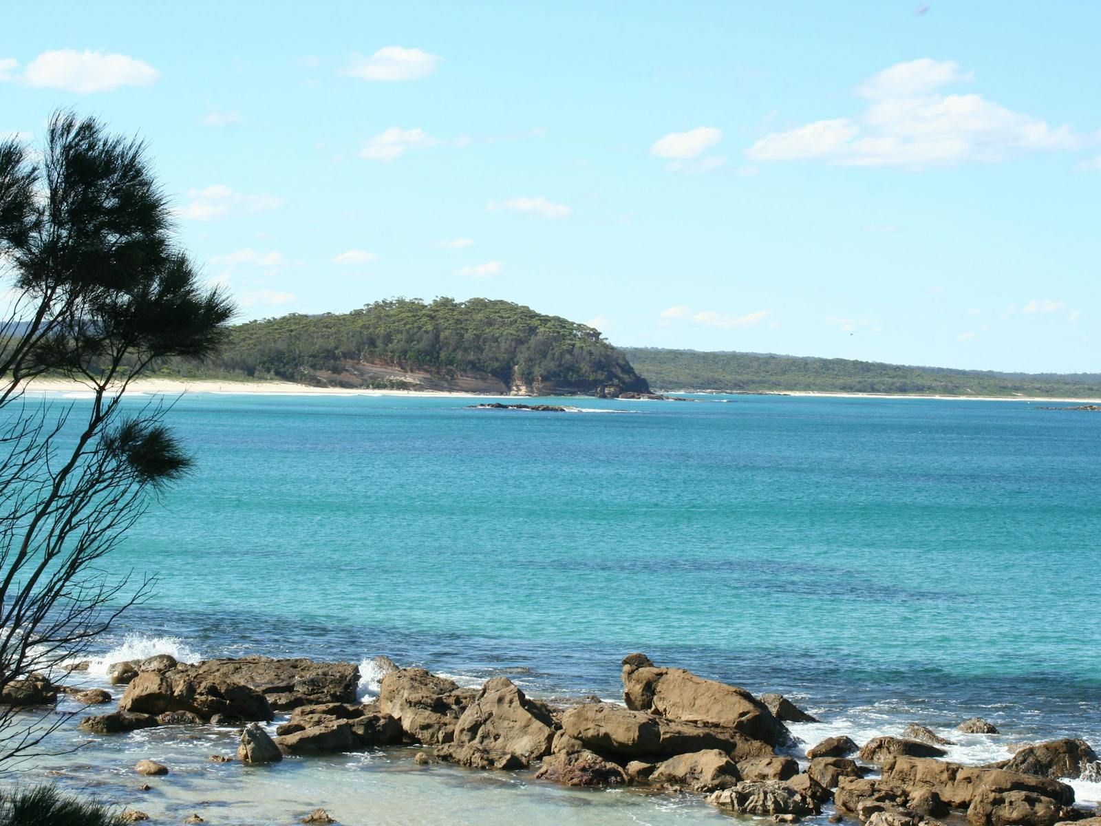 Narrawallee Beach and Inlet showing pristine surf breaks and protected waterways - ideal location for surfing lessons near Ulladulla, NSW